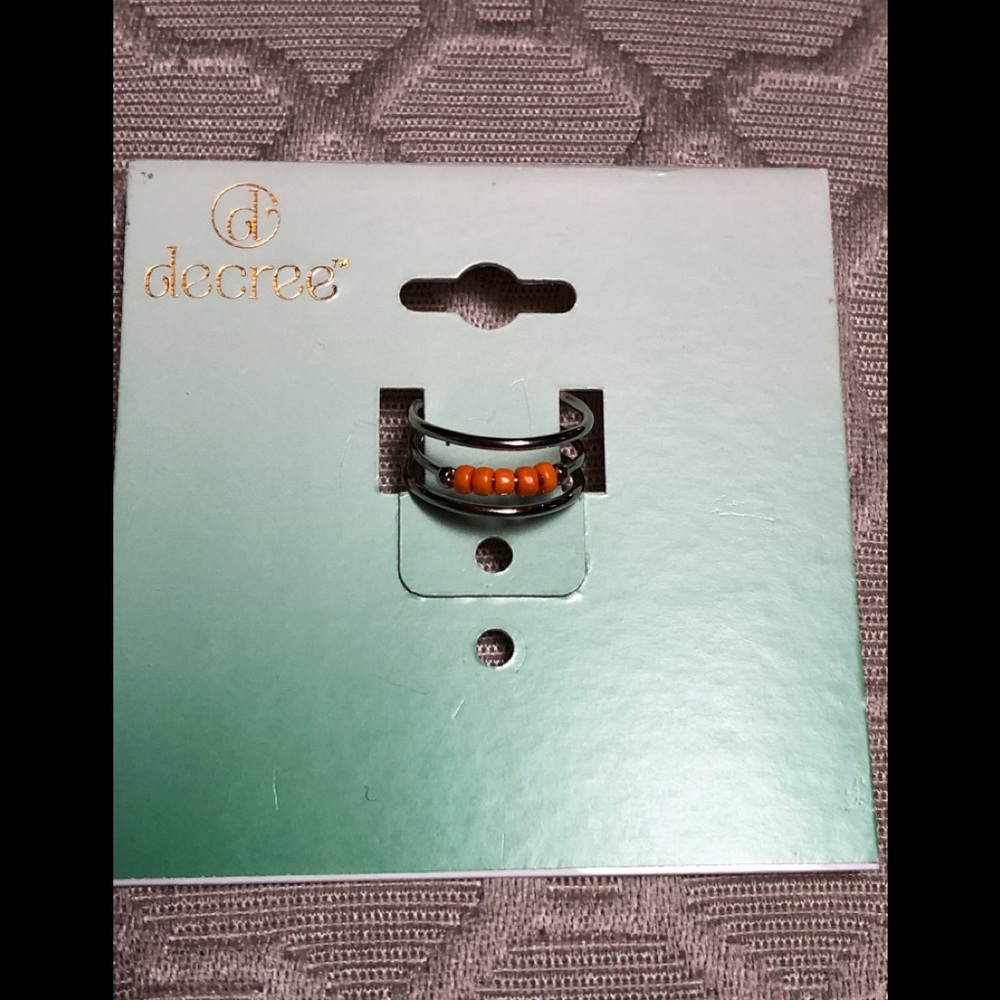 Orange bead adjustable silver tone toe ring.
